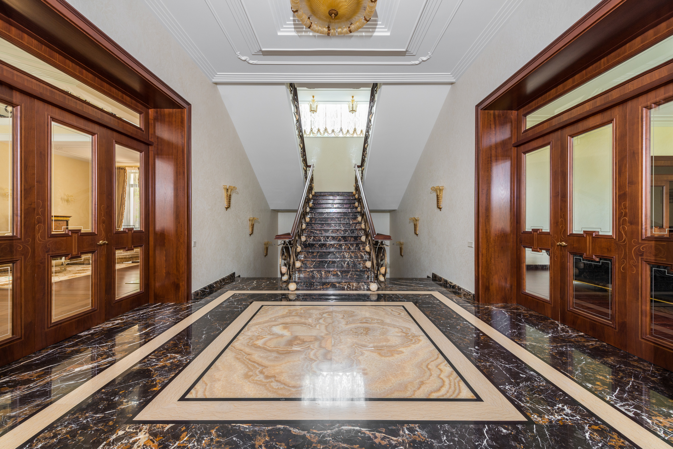 Interior of hallway with marble floor in luxury apartment